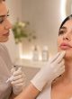 Russian Lip Filler Consultation in Reading Aesthetic practitioner assessing a client’s lips during a Russian lip filler consultation in Reading